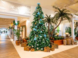 A Large Room With A Christmas Tree