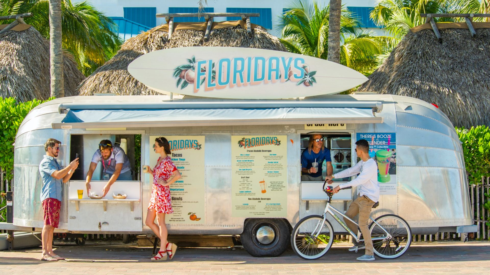 A Group Of People Standing Outside A Food Truck